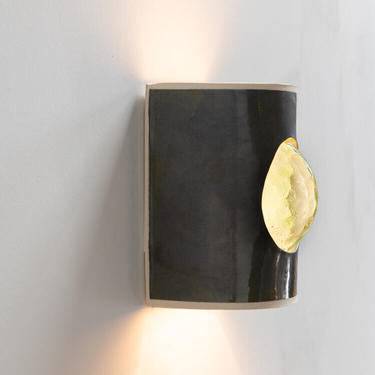 Avocado Wall Sconce with Glass handcrafted ceramic wall light Australia lit from side angle showing glowing glass insert and ambient light
