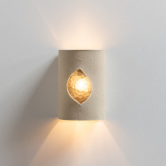 Beach Wall Sconce with Glass handcrafted ceramic wall light Australia with raw unglazed clay and glowing glass insert lit with warm ambient light