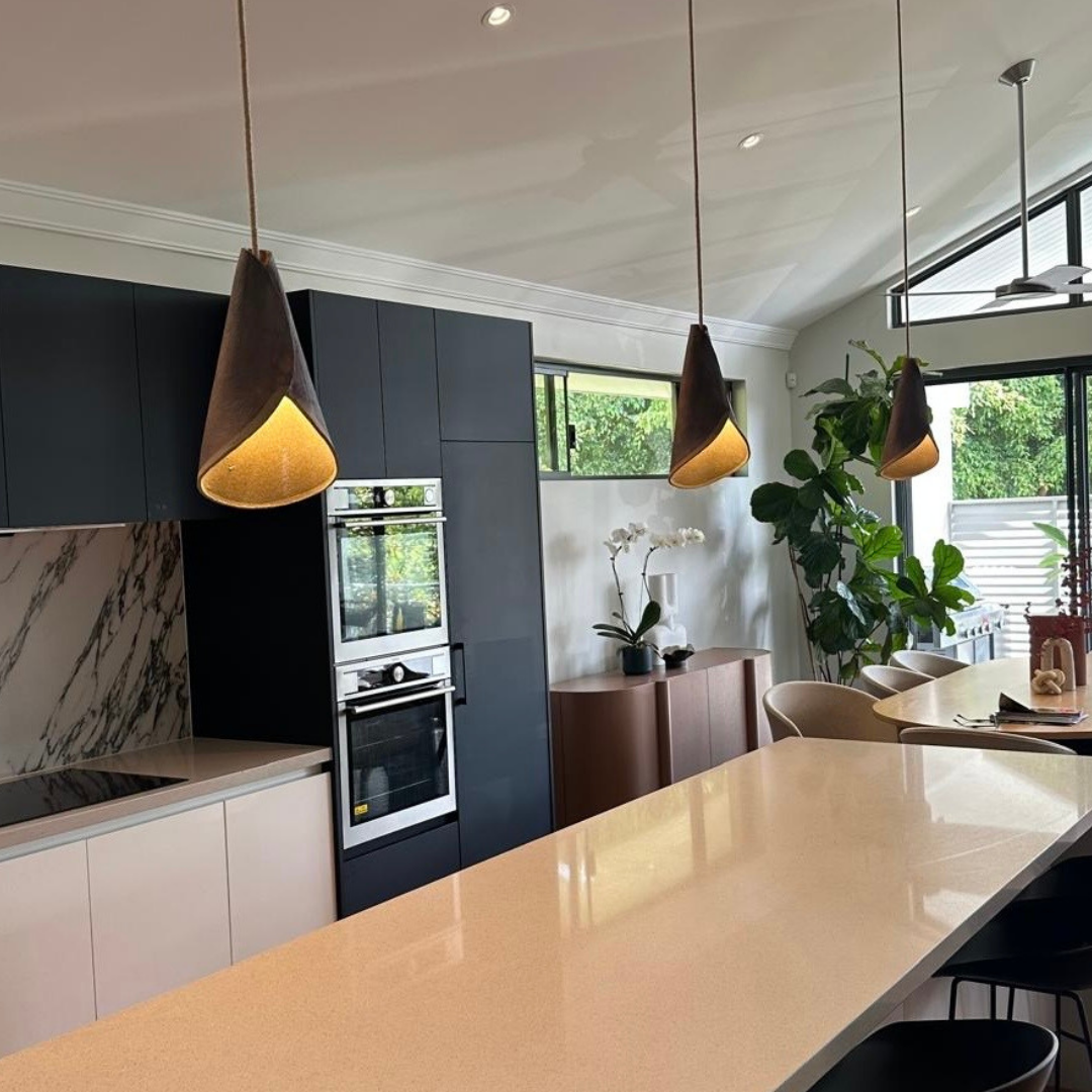 The Bouquet pendant handcrafted ceramic pendant lights Australia in rust finish installed over kitchen island creating warm ambient lighting