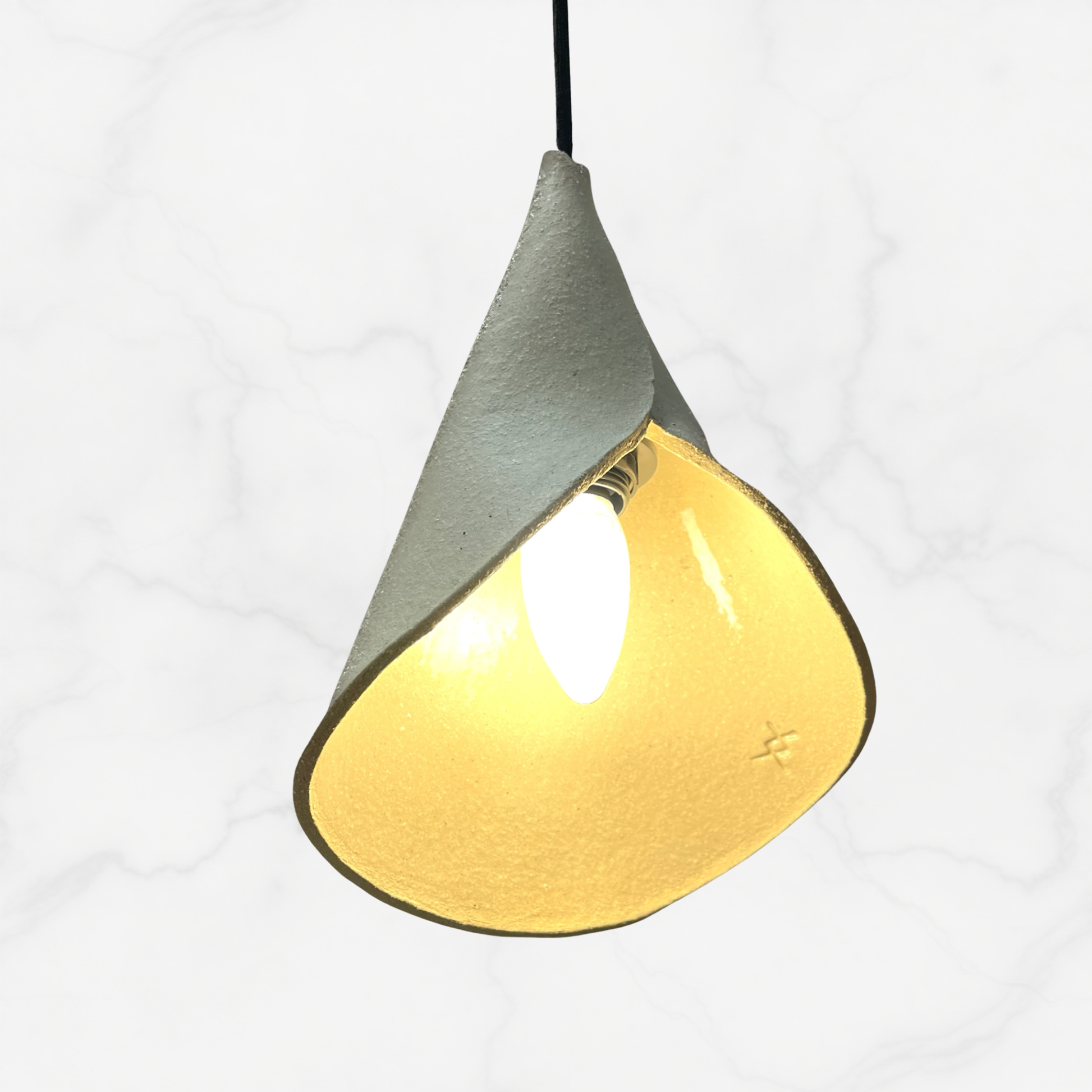 The Bouquet pendant handcrafted ceramic pendant light Australia in raw sand coloured clay with natural texture and sculptural folded form