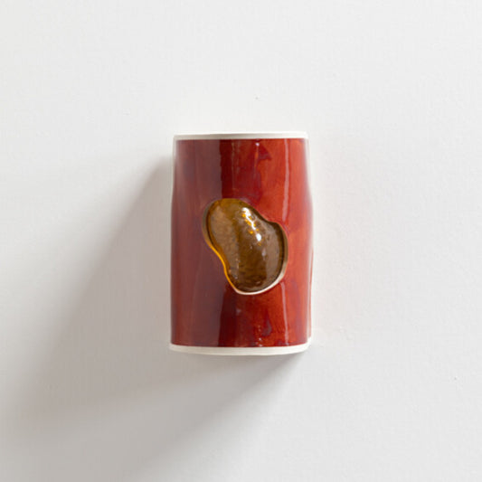 Burnt Orange Wall Sconce with Glass handcrafted ceramic wall light Australia showing glass emerging through burnt orange glazed ceramic surface