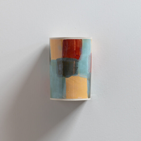 Carnival Wall Sconce handcrafted ceramic wall light Australia with layered colourful glaze on white background