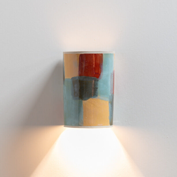 Carnival Wall Sconce handcrafted ceramic wall light Australia lit showing warm ambient light cast downward