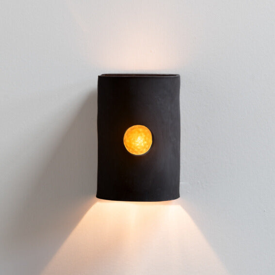 Charcoal Wall Sconce with Glass handcrafted ceramic wall light Australia lit showing glowing glass insert and warm ambient light