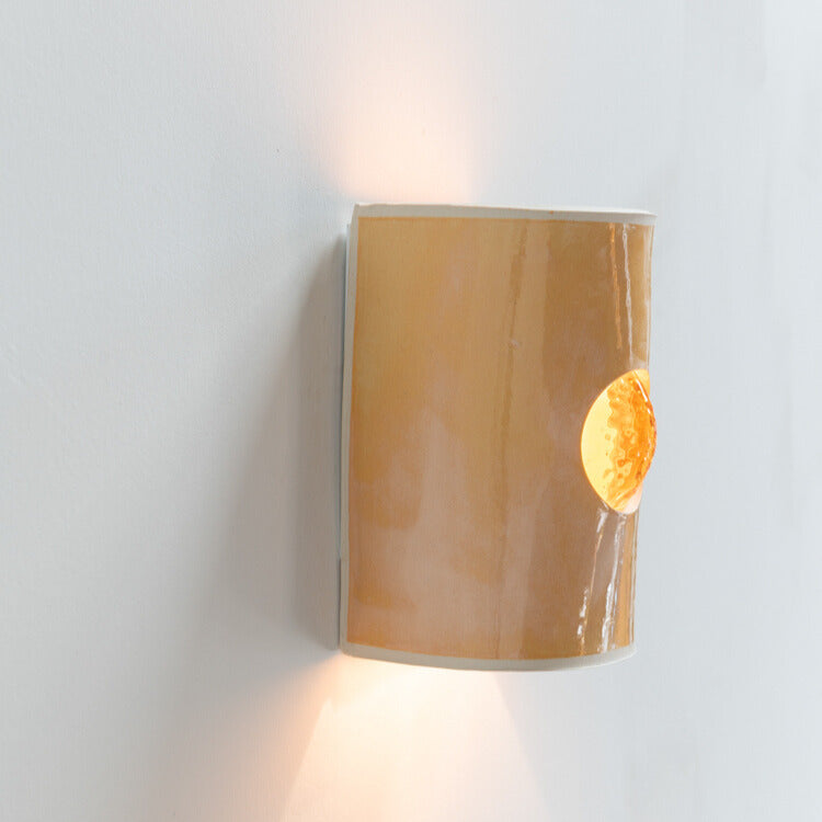 Coral Wall Sconce with Glass handcrafted ceramic wall light Australia lit from side angle showing glowing glass insert and warm ambient light
