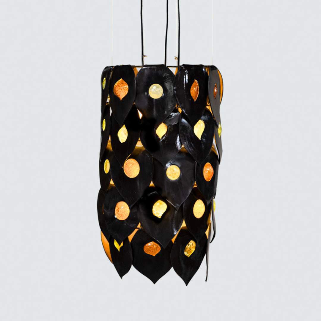 Dusk chandelier handcrafted black ceramic and glass pendant light Australia sculptural layered form with warm glowing glass inserts