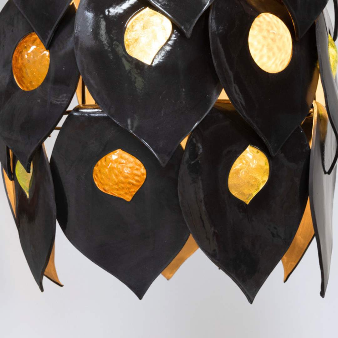 Dusk chandelier handcrafted black ceramic pendant light Australia detail of layered ceramic petals with warm ambient light glowing through glass