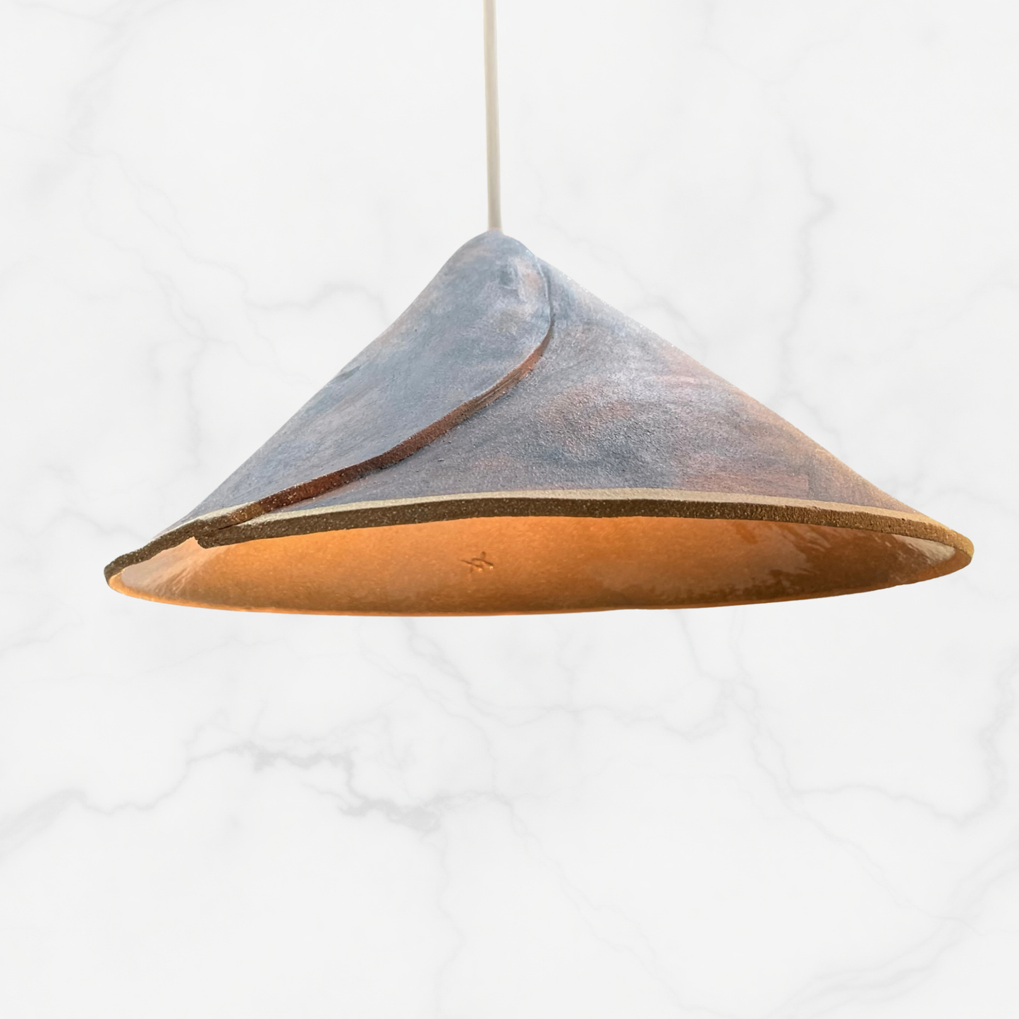 The Envelope pendant handcrafted ceramic light Australia featuring a signature folded form that wraps light in a soft architectural silhouette