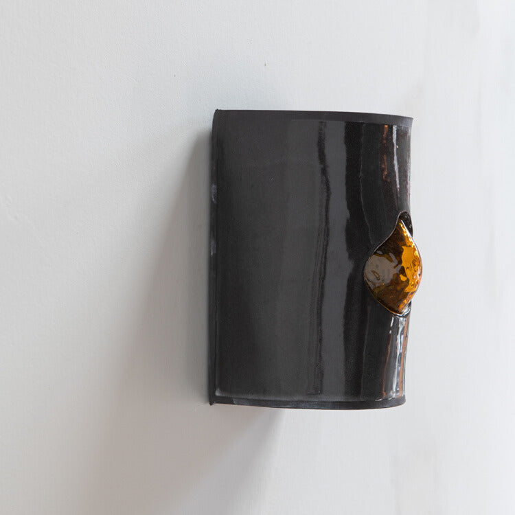 Gloss Black Wall Sconce with Glass handcrafted ceramic wall light Australia showing side detail of glass emerging through ceramic form