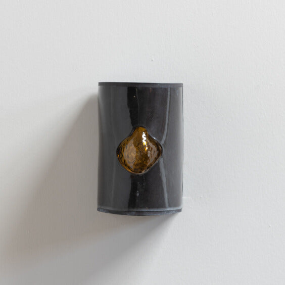 Gloss Black Wall Sconce with Glass handcrafted ceramic wall light Australia showing glass emerging through glossy black ceramic surface