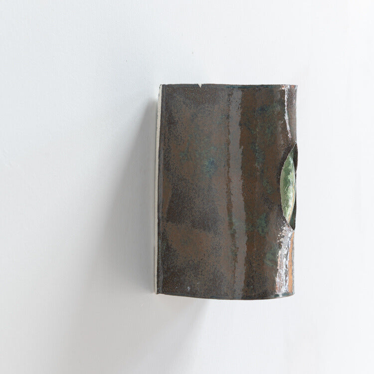Green Stone Wall Sconce with Glass handcrafted ceramic wall light Australia showing side detail of glass emerging through ceramic form