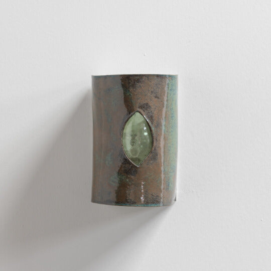Green Stone Wall Sconce with Glass handcrafted ceramic wall light Australia with stone-like glaze and green glass insert on white background