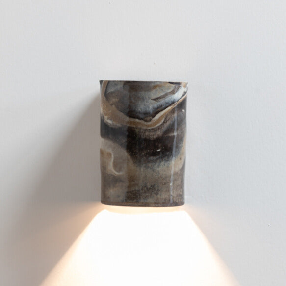 Marble Wall Sconce handcrafted ceramic wall light Australia made from blended clays creating marbled effect, lit with warm ambient light