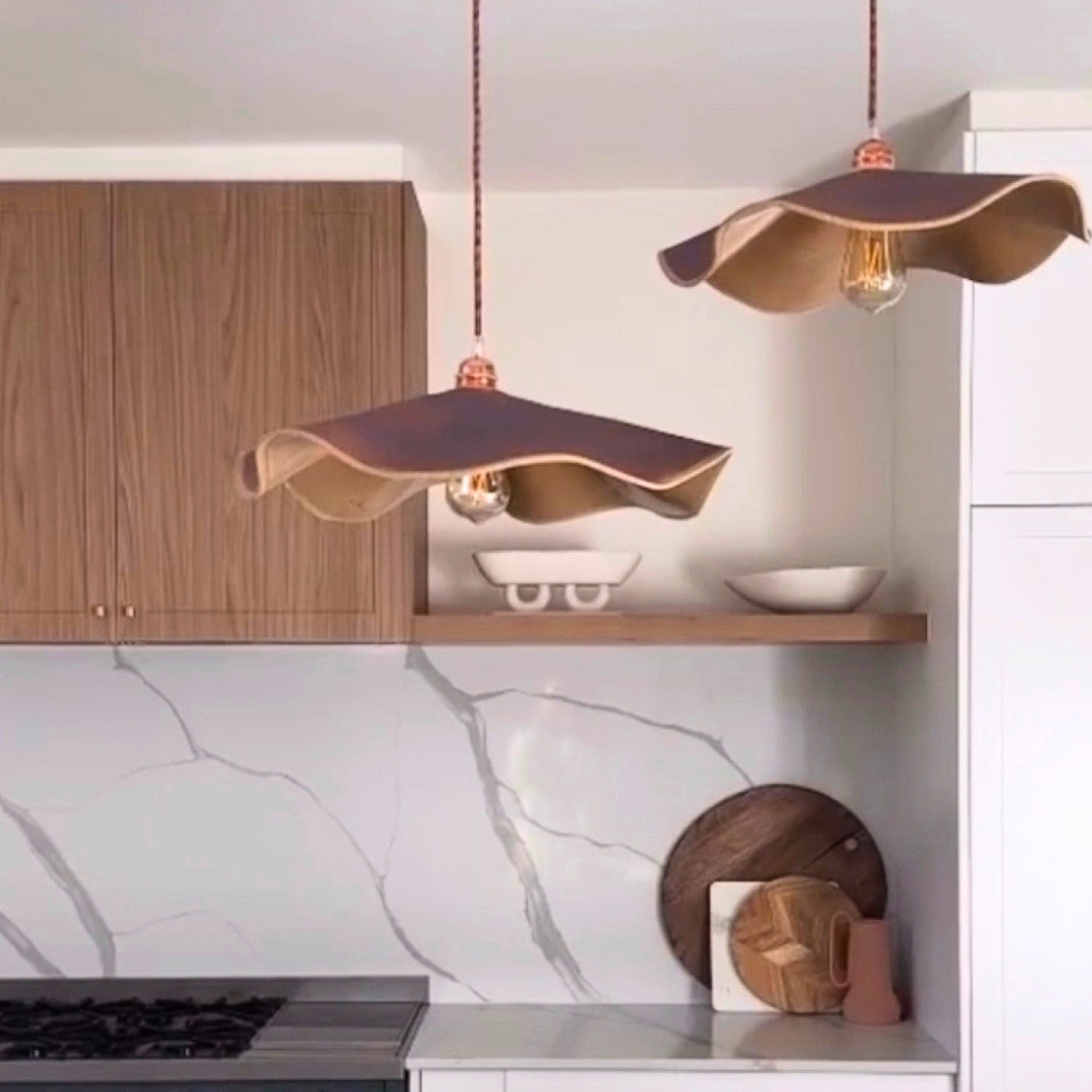 Modern kitchen with ceramic pendant lights and marble backsplash