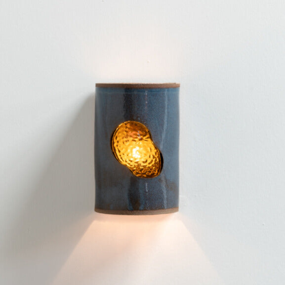 Midnight Blue Wall Sconce with Glass handcrafted ceramic wall light Australia with deep blue glaze and glowing glass insert lit with ambient light