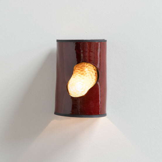 Shiraz Wall Sconce with Glass handcrafted ceramic wall light Australia with deep wine-coloured glossy glaze and glowing glass insert lit with ambient light
