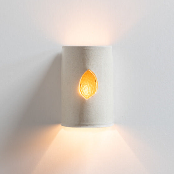 Stone Wall Sconce with Glass handcrafted ceramic wall light Australia with glass insert glowing warmly and ambient light cast upward and downward