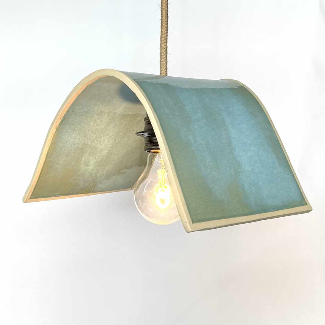 Tile pendant handcrafted ceramic pendant light Australia in Lac Bleu blue glaze with curved tile form and exposed bulb detail