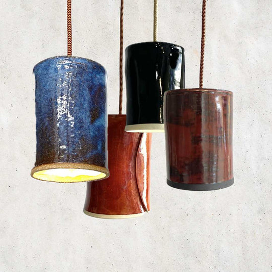 The Tumbler pendant collection handcrafted ceramic lighting Australia showing multiple glaze finishes and cylindrical forms