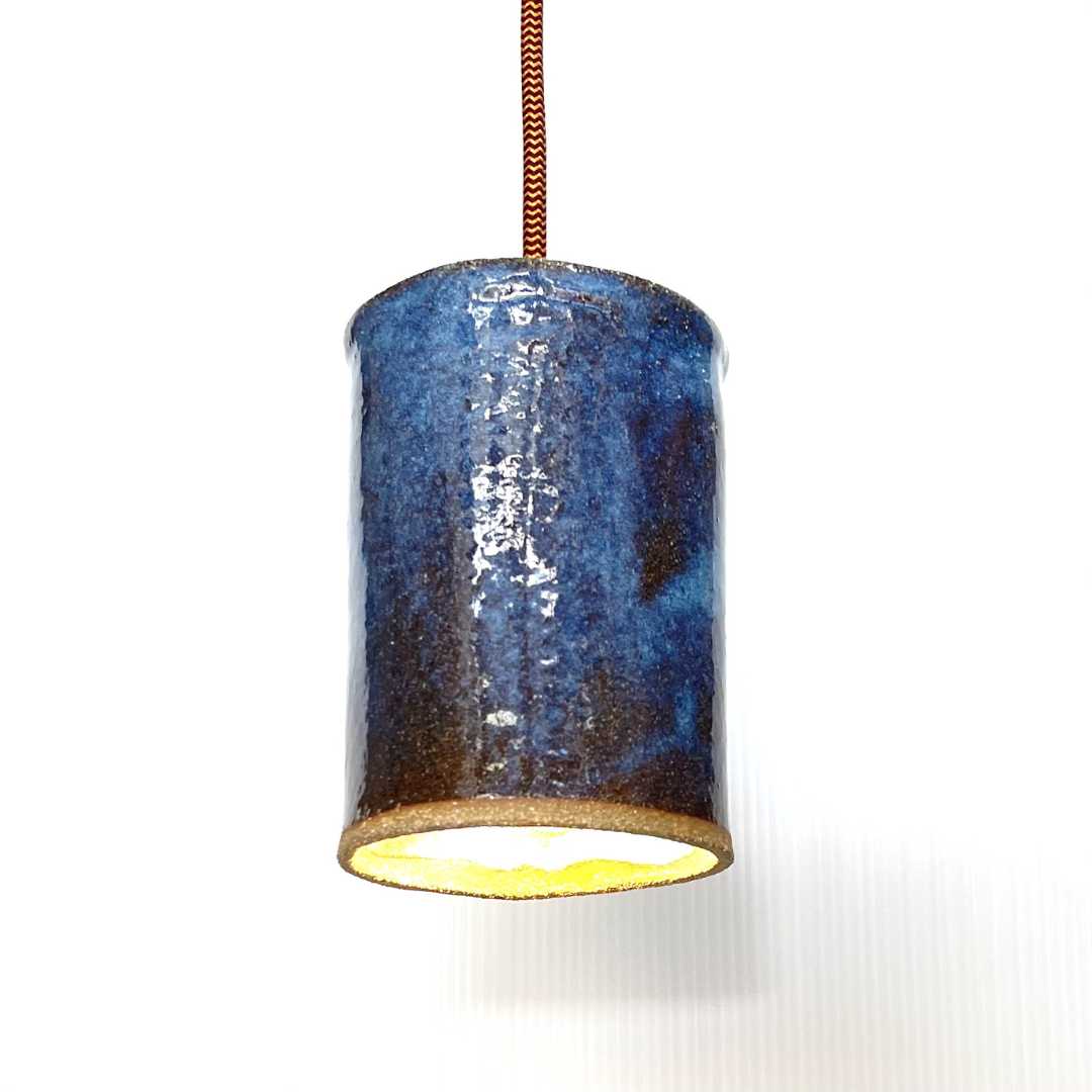 The Tumbler pendant handcrafted ceramic light Australia in midnight blue glaze with rich tonal variation and cylindrical form